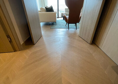 Luxury apartments at St John's Wood - chevron style flooring in a hallway