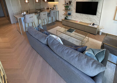 Luxury apartment living area with chevron flooring