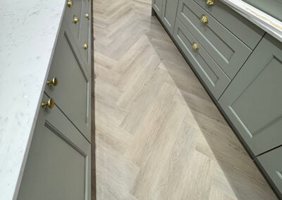 Luxury vinyl installation of herringbone oak effect floors