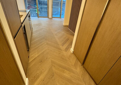Chevron flooring in multi-unit Aldgate development
